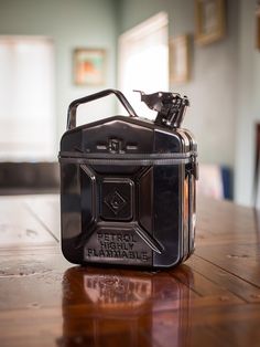 a black case sitting on top of a wooden table