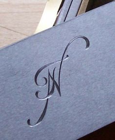 a close up of a business card with the letter w on it's side