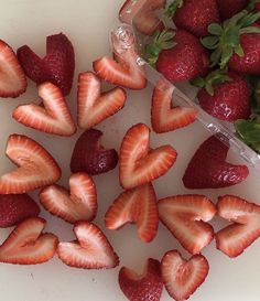 strawberries are arranged in the shape of hearts