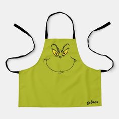 a green apron with an image of dr seuss's face on the front