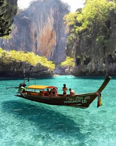 two people on a boat in the clear blue water