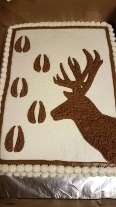 a sheet cake decorated with an image of a deer