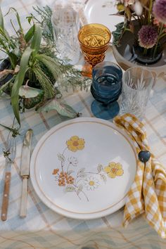 the table is set with dishes and utensils, including an old - fashioned china plate