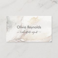 marble business card with the words, ollivia reynoldss suite estrato