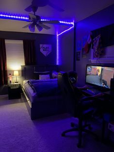 a bed room with a neatly made bed and purple lighting