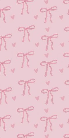 pink bows and hearts on a light pink background for wallpaper or wrapping paper,