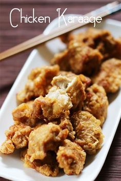 chicken karasage on a white plate with chopsticks