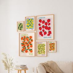 a living room filled with furniture and pictures on the wall