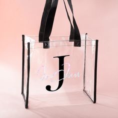 [EASY TO CARRY AND SECURITY CHECK]: Functionality is also a top priority when it comes to our transparent tote bags. Our clear tote bag 12x6x12 inch measurement is perfect for conveniently carrying all your essential items, including your phone, wallet, sunglasses, sunscreen, and more. The sturdy handles ensure comfortable carrying, so you can stay hands-free and enjoy your event without any discomfort. The transparent design also allows for easy visibility and accessibility, allowing security p Personalized Black Rectangular Bag, Clear Rectangular Gift Bag, White Bag With Clear Strap For Gift, Personalized Black Shopping Bag, Personalized Black Bag For Shopping, Clear Tote Bag For Gift, Rectangular Clear Bag, Trendy Clear Bags For Personal Use, Clear Beach Bag