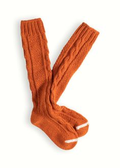 The Wool Collection High-Knee Cable Knit Socks are knitted in a plain color recycled lambswool with a contrast on the tip.They are designed with an extra high up to the knee so they are perfect with boots or shoes.Their cable knit makes the beautiful colors standing up.They are the perfect choice for the most fashionable looks without rejecting the tradition. ADVANTAGES; Finely ribbed knit, Perfect fit, Skin-friendly, Lambswool construction, Maximum comfort. Cable Knit Socks, Orange Socks, Plain Color, High Knees, Knee High Socks, White Sock, Knit Socks, Knitting Socks, Cable Knit