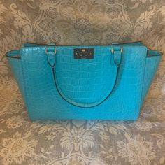 Beautiful Turquoise Croc Embossed Leather Handbag. Brand New, Never Used. Smoke Free Home. 14” Wide X 9.5” High. Handle Drop 6.25”. Luxury Turquoise Travel Bags, Blue Business Satchel, Designer Light Blue Formal Bags, Light Blue Formal Bags With Gold-tone Hardware, Classic Light Blue Shoulder Bag For Formal Occasions, Formal Light Blue Bags With Gold-tone Hardware, Kate Spade Green Office Bag, Green Kate Spade Office Bag, Business Blue Shoulder Bag With Handle Drop