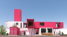 a pink and white building with people standing outside