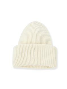 Details: Rib knit wool beanie in white 'LA' patch at rolled brim Materials & Care: 51.6% Acrylic, 48.4% Wool Do not wash Do not bleach Item #: VL3JW01 Classic White Winter Beanie, Classic White Beanie For Winter, White Cotton Beanie For Winter, White Warm Cotton Beanie, White Cotton Hats For Cold Weather, White Ribbed Beanie Hat, White Ribbed Winter Hat, White Wool Casual Hat, Warm White Cotton Hat