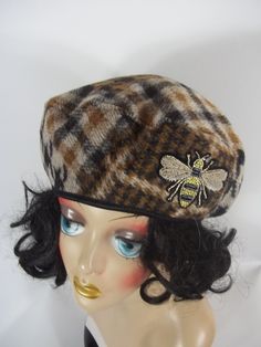 - fashion, beret, fall, winter, - coating wool blend - not lined, - patchwork plaid in browns, beige and black, - bee applique, stitched on, - black fold over elastic skinny hatband, - dry clean, - sizes S,M,L Your head circumference: 21.5 inches - size S 22.5 inches - size M 23.5 inches - size L SHIPPING is free in USA. Processing time: 1-3 business days before shipping. Ships by USPS, 3-4 business day delivery. RETURNS: send it back within 5 days after you received it. Return address is on the Winter Retro Brimmed Beret, Adjustable Retro Winter Beret, Applique Fashion, Brown Military Hat For Winter, Brown Vintage Winter Beret, Plaid Beret, Bee Applique, Elegant Wool Beret Cap, Black Bee