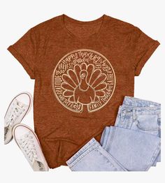 a women's t - shirt with a turkey on the front and two pairs of jeans