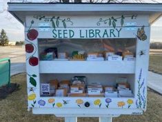 an old fashioned seed library in the grass