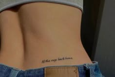 a woman's lower back tattoo with the words all the rage has come on it