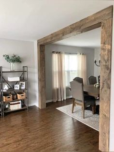 an open living room and dining area with wood flooring