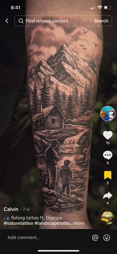 a man's arm with a mountain scene on it