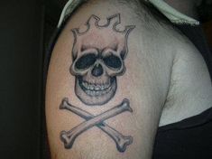 a man with a skull and crossbones tattoo on his shoulder