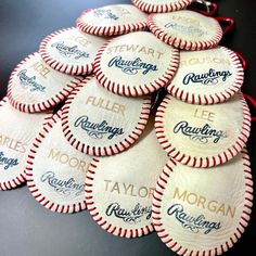 a bunch of baseballs that are on top of a table with the name morgan written on them