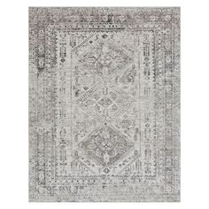 a gray rug with an ornate design on the top and bottom, in front of a white