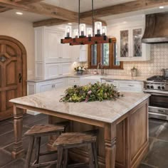 a large kitchen with an island in the middle