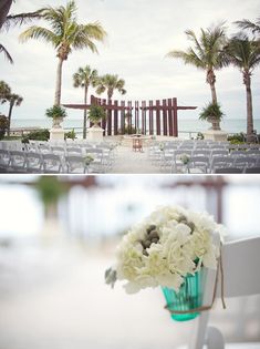 wedding ceremony setup with chairs and flowers in vases on the table at the beach