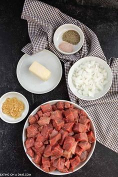 the ingredients to make this recipe include meat, onions and cheese in bowls on a black table