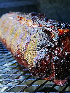 the meat is being cooked on the grill