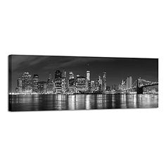 a black and white photo of the city skyline at night in new york, ny