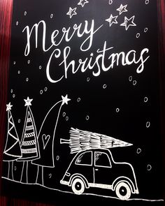 a chalkboard drawing of a car with a christmas tree on the roof and merry lettering