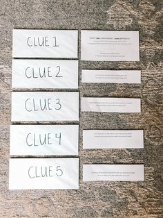 four pieces of white paper with black writing on them that say clue 2, clue 3, and clue 4