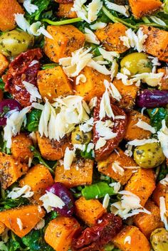 a salad with carrots, brussel sprouts and parmesan cheese