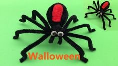 a spider made out of yarn sitting on top of a green surface with the words halloween written