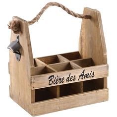 a wooden box that has some sort of wine bottle in it with the words biere des amis on it