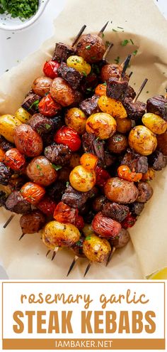 steak kebabs on skewers with tomatoes and parsley