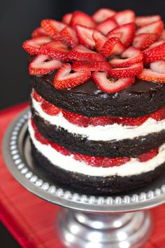 a chocolate cake with strawberries on top