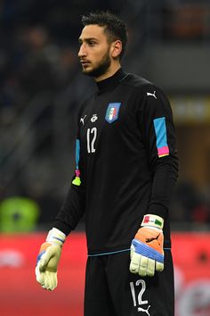 a soccer player wearing gloves on the field