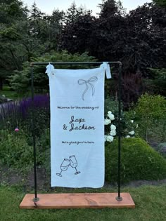 a towel hanging on a stand in the grass