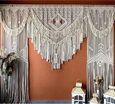 the wall is decorated with white macrame