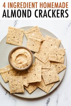 three ingredient homemade almond crackers on a plate with the words, 3 ingredient homemade almond crackers