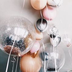 an instagram with balloons and confetti hanging from it's sides on a phone screen