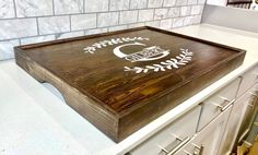 a wooden cutting board sitting on top of a counter