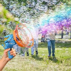 people playing with bubbles in the park