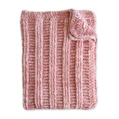 a pink crocheted blanket with a tassell on the top and bottom