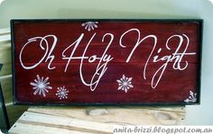 a wooden sign that says happy night with snowflakes