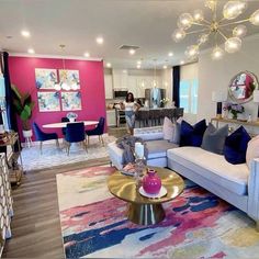 a living room filled with furniture and colorful walls