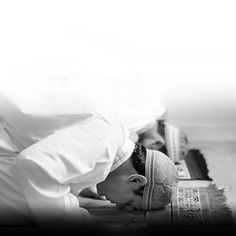 a man laying on the ground with his head down