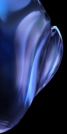 an abstract image of blue and purple liquid flowing down the side of a glass vase